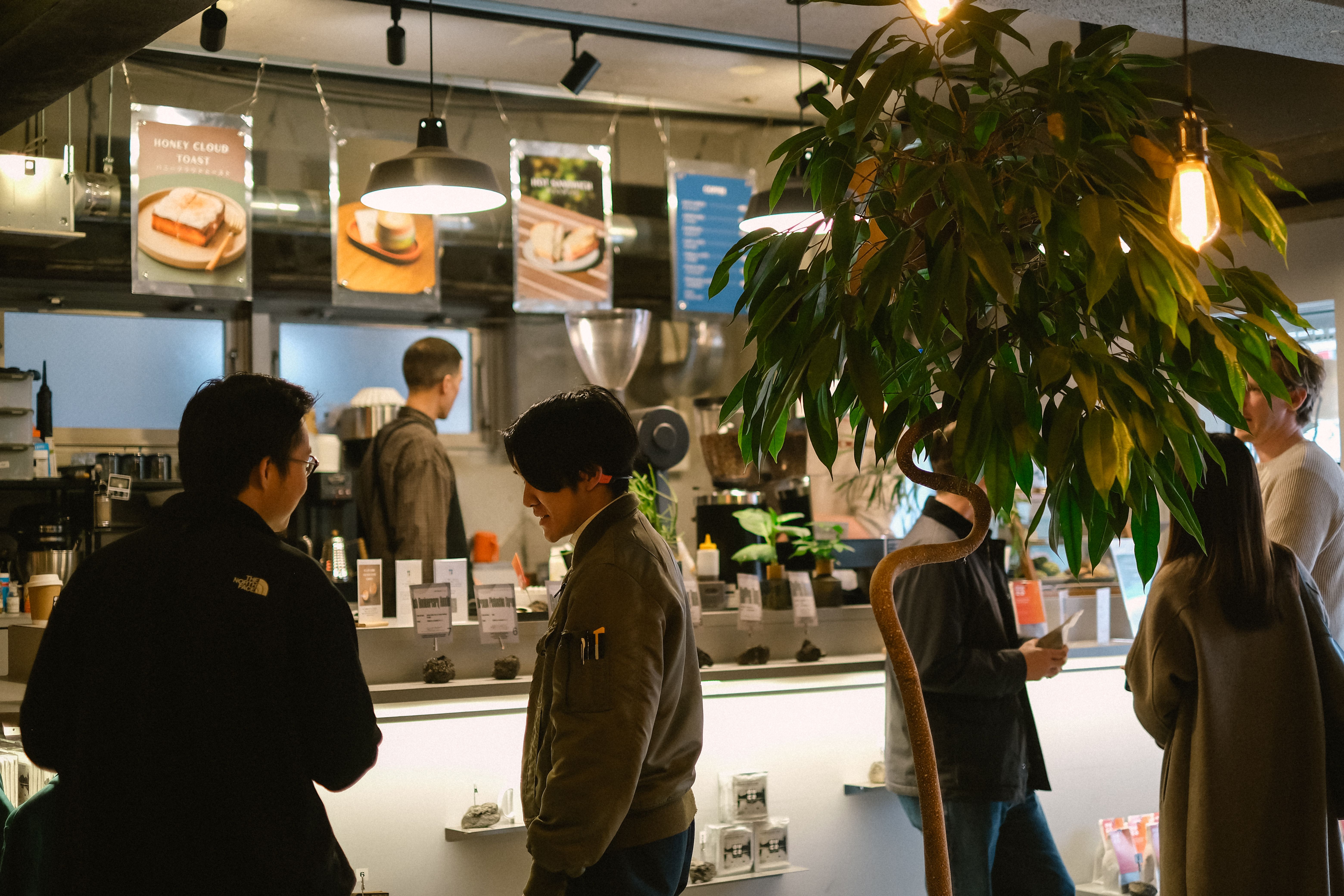 Guests ordering coffee at the Over Coffee cafe counter