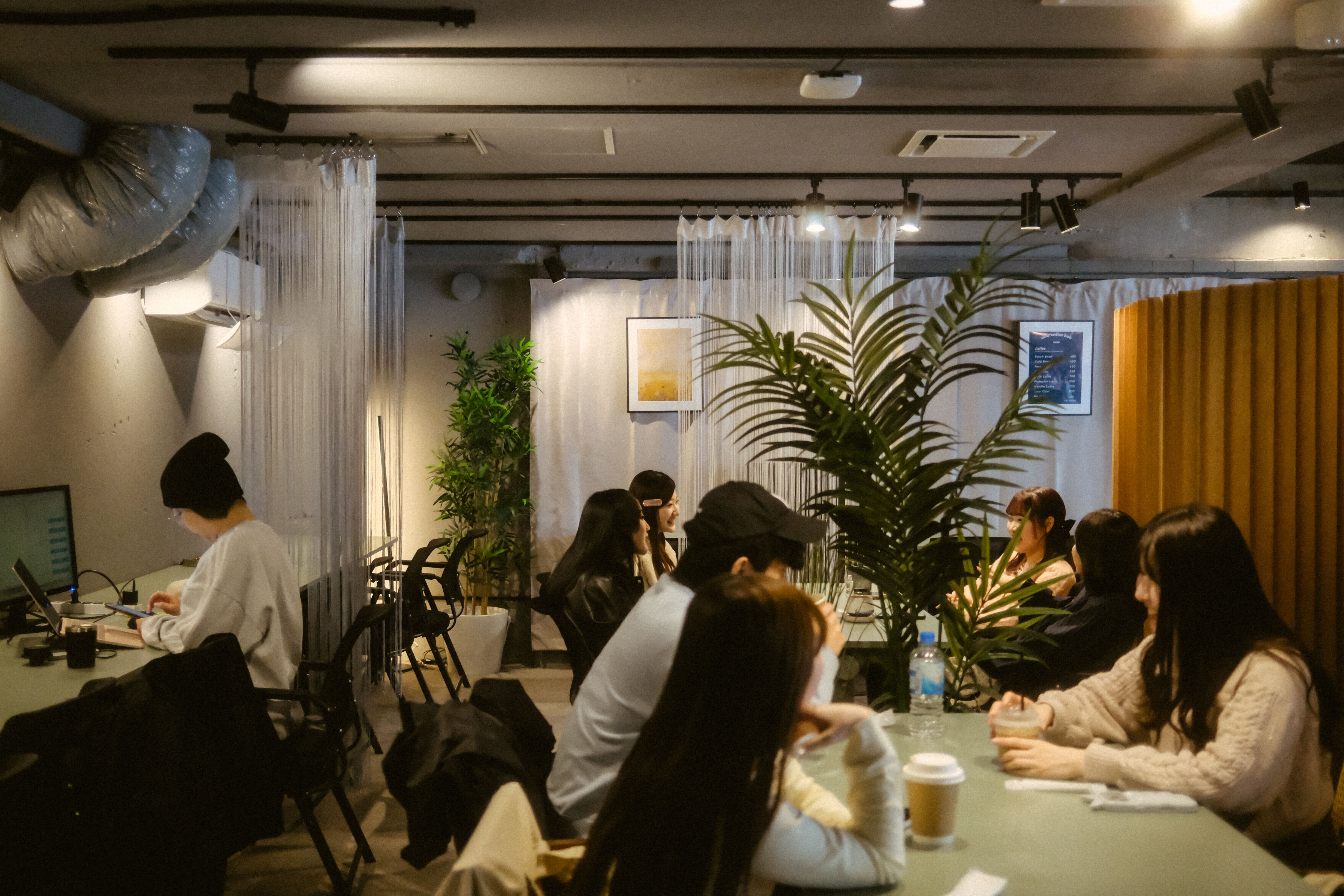 Community members gathered around a cafe table