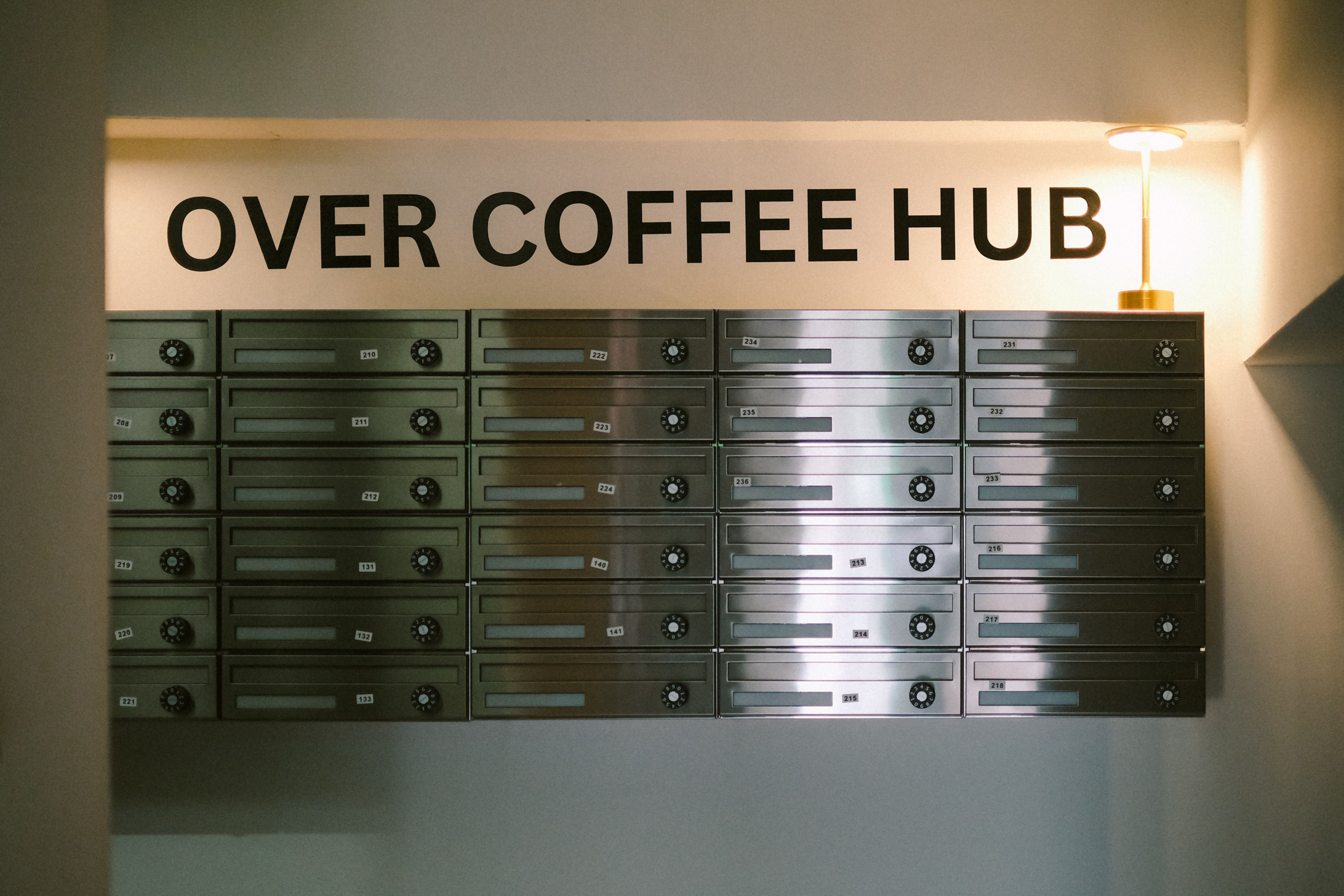 Over Coffee Hub mailbox wall and entrance signage